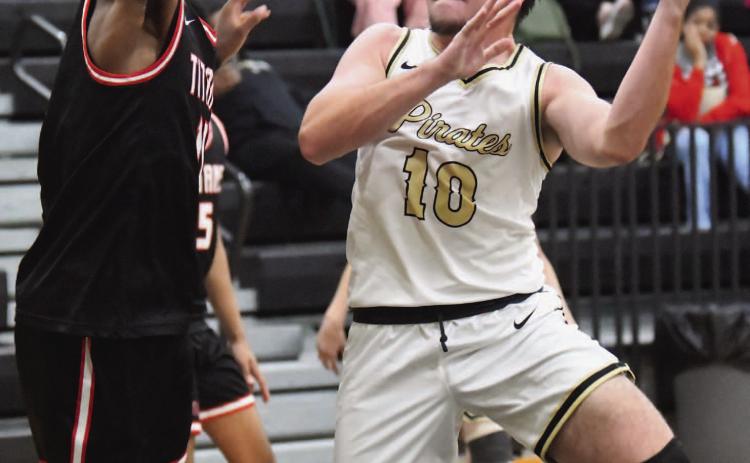 Camden Young attempts a one-handed under the basket.