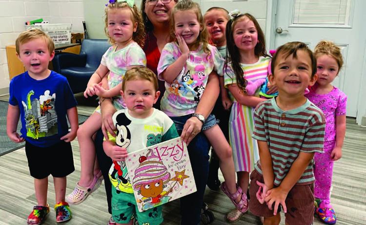 The Vidor Public Library held the last Itty Bitty Storytime for 2024-2025. Library clerk Sarah Screws read “Izzy the Ice Cream Fairy “by Tim Bugbird. “Izzy and her friends run a magical ice-cream stall on the beach, until one day they discover that their ice-cream well has run dry. The friends travel to a new land in search of more delicious ice cream.” The children colored wooden ice cream cut-outs for the craft and enjoyed making ice cream for their treat.