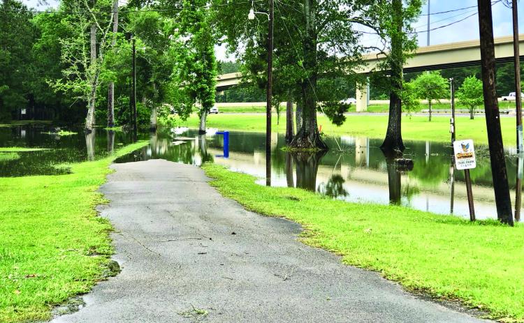 Afternoon and overnight thunderstorms brought damaging winds to portions of Orange County but the Vidor area mostly experienced minor flooding. The Claiborne Park’s walking track is partially underwater in the photo taken Tuesday afternoon. Photo by Randall Luker