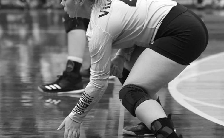Aarilynne Richardson prepares to receive a serve. Photo by Randall Luker