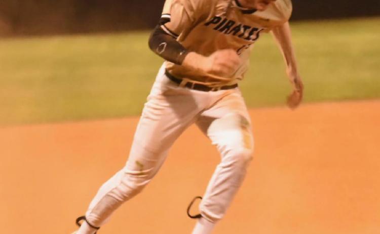 Regan Weiblinger puts his head down and heads for home plate in Friday’s game versus Bridge City. Photo by Randall Luker