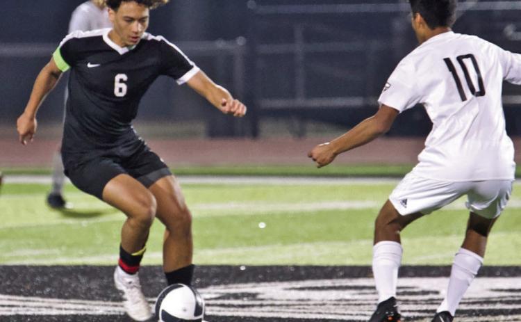 It’s all in the feet Rui Correia maneuvers past an Anahuac defender in Monday’s scrimmage. the Pirates won 7-0.