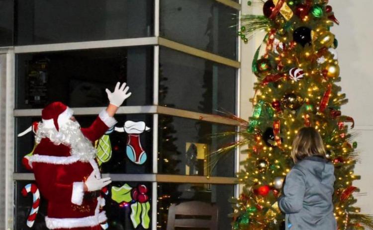 Santa and Mayor light the town Christmas tree during this year's annual Hometown Holidays celebration. Photo by Randall Luker