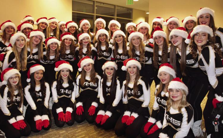 The Vidor High School Brigadettes, dressed in bright holiday garb, wowed the crowd with their synchronized hand routines set to holiday music at their Vidor City Hall performance under the direction of Cherise Fawcett.