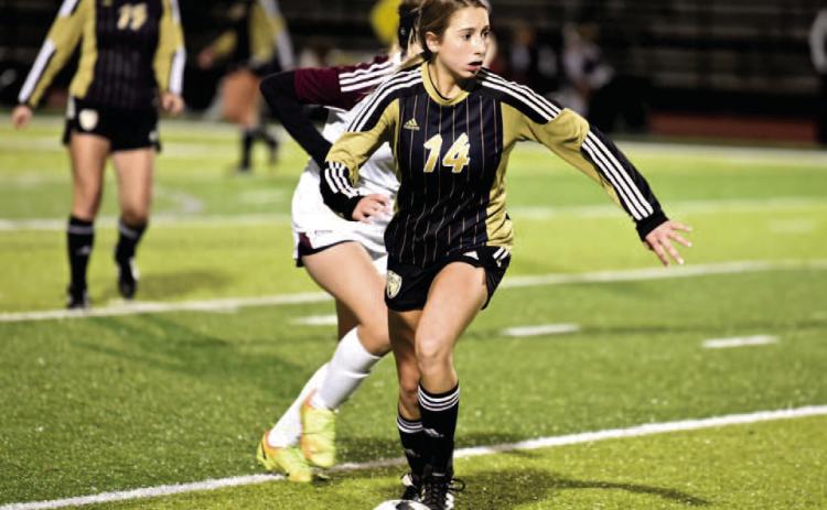 Michaela Droptini dribbles past a Silsbee defender. Photo by Randall Luker