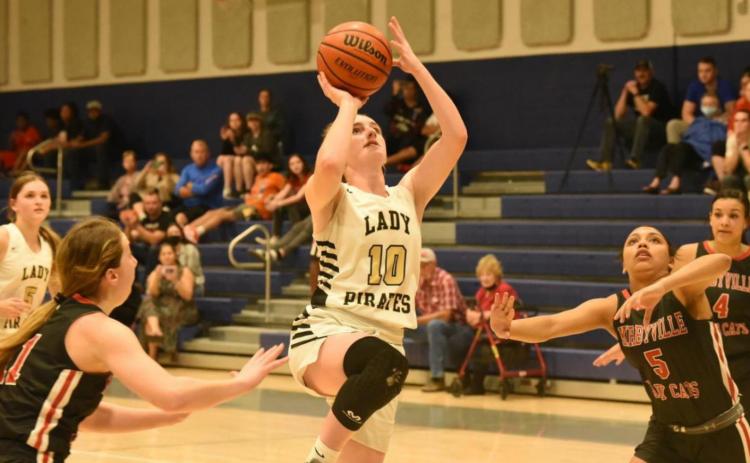 Natalie Morrison shoots for two in the Championship round of the WOS Tournament Thursday. Photo by Randall Luker