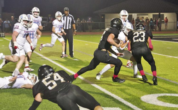 Pirate RB Dane Villadsen heads for the end zone and a touchdown behind the blocking of Jayden Jones, #23.