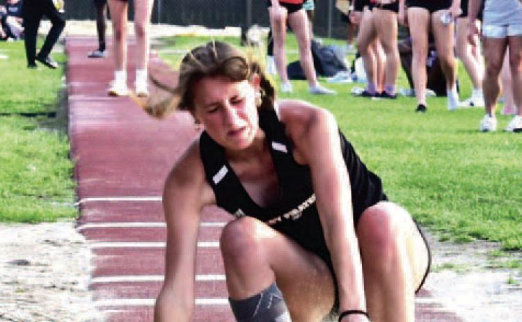 Sand flies as senior Lady Pirate Jaden Lee makes her landing in the Triple Jump event at Thursday’s VHS Invitational Track Meet. Lee took first place in the event with a leap of 35’ 10.75”. Vidor Track and Field athletes will be in competition next in Anahuac at the Gid Campbell Relays March 23.. Photo by Randall Luker