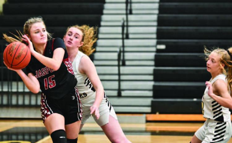 Lady Pirates Natalie Morrison, center, and Mia Robin, right, pressure a Jasper Lady Dawg as she looks to pass Friday at Pirate Gym. Photo by Randall Luker