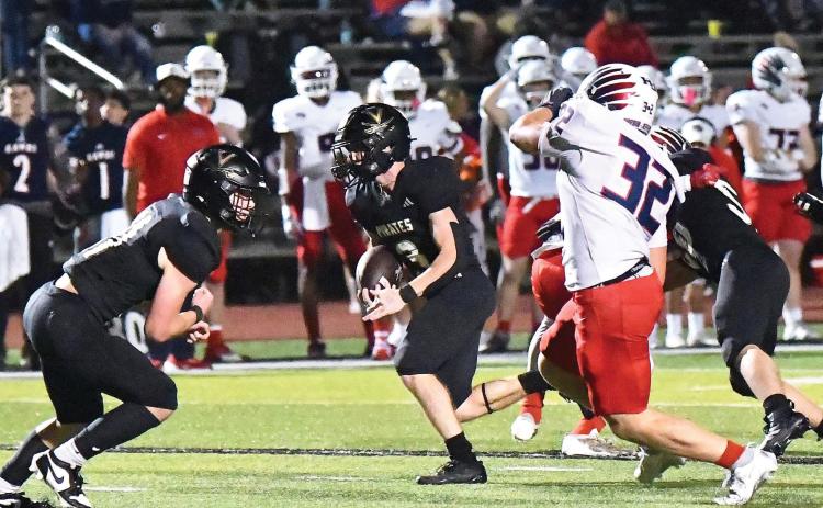 Landon Jones breaks into the open as Brody Bloss prepares to block his pursuer.