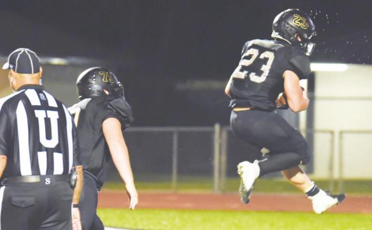 Trenton Conn jumps for joy as he scores the game winning overtime touchdown versus Brazosport Friday.