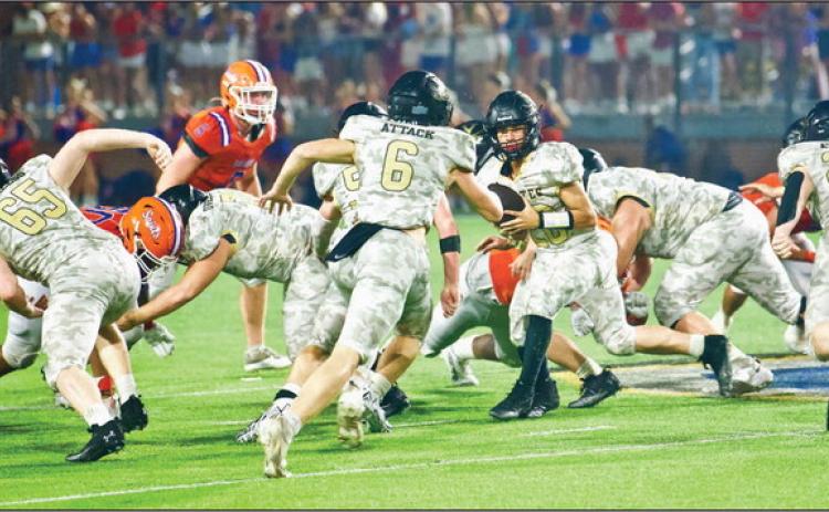 Pirate QB Daigan Venable hands the ball off to #6 Dane Villadsen as #65 Blane Ragan other unidentified linemen and #26 Riley Marlow block. Photo by Randall Luker