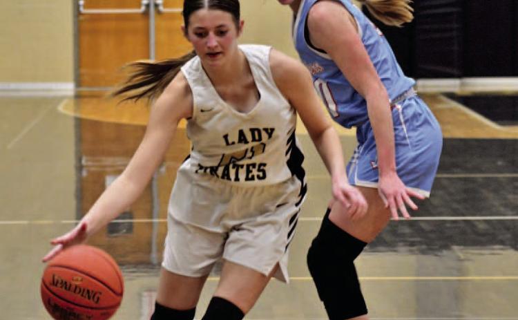 Lady Pirate Madison Powell drives on the goal in Friday’s district opener versus Lumberton. Photo by Randall Luker
