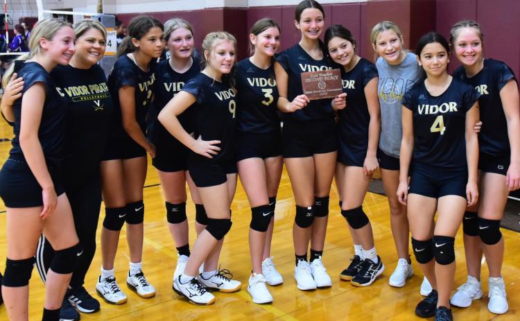 Freshman Lady Pirates place second at Silsbee Tournament and pose with their plaque Saturday. Photos by Randall Luker