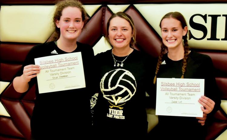Rylee Sherman, left, and Jaden Lee, right were named to the All Tournament Team at the Silsbee Volleyball Tournament Saturday. They are pictured with Vidor’s first year Head Volleyball Coach Brooklyn Sampere. Photo by Randall Luker