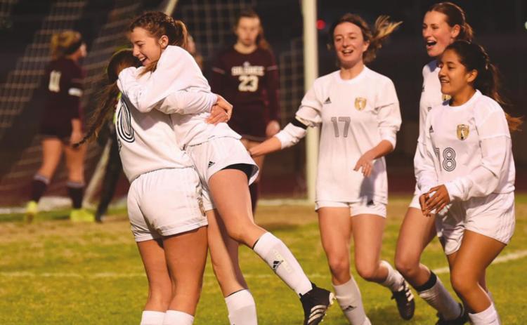 Teammates congratulate Chloe Post after she scored her fourth goal of the night against Silsbee, Pictured left to right are Taylor LaPray, Post, Amelia Wright, Jaden Lee and Johana Aguirre. Photo by Randall Luker