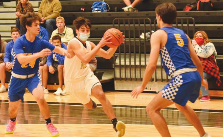 Aiden Ochoa drives on the goal between Kelly defenders Tuesday night.