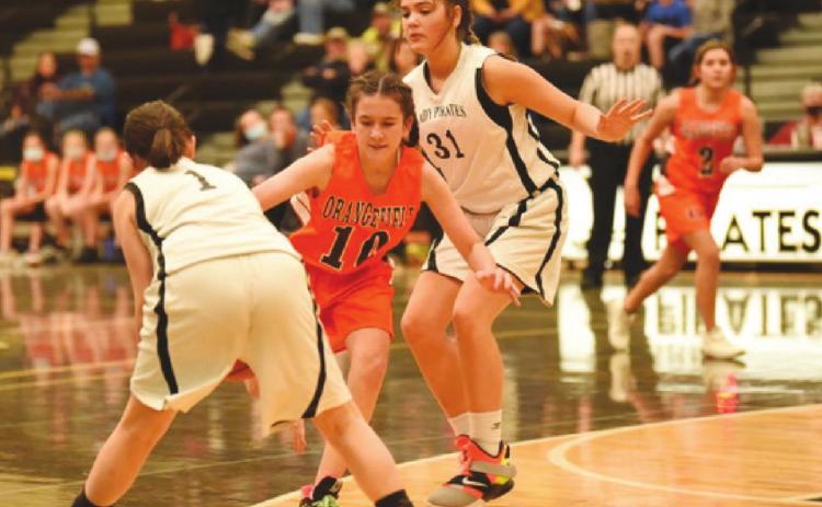Eighth A Lady Pirates Lakyn Croak, #1, and #31, Kinsey Dillard defend agains a charging Lady Bobcat.