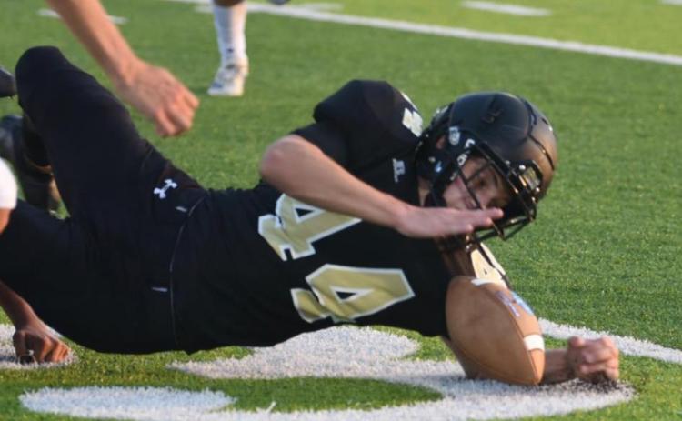 Tate Ardis recovers a Buna fumble Friday. Photo by Randall Luker