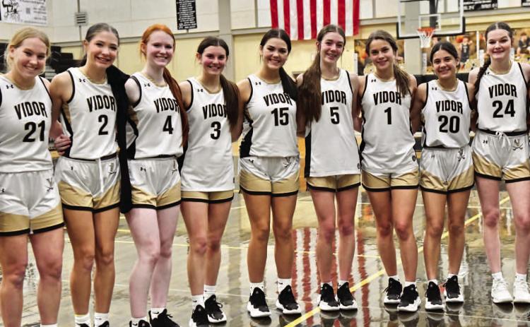 The Lady Pirates pose for a team photo after their 78-42 win over district foe Jasper.