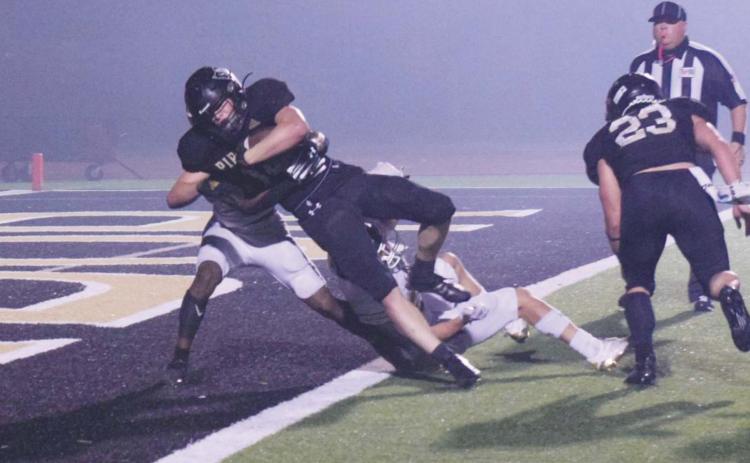 Pirate RB Jason Watson caps a 10-yard run with a touchdown in fourth quarter action Friday.