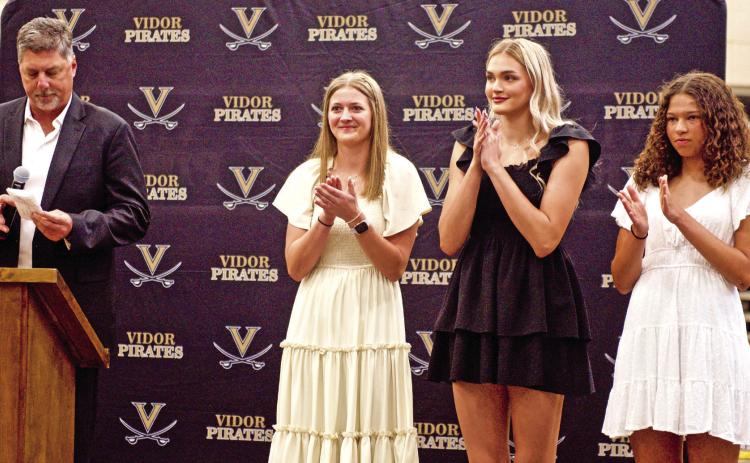 VHS Girls Athletic Coordinator Shad Smith presented the awards for Heart of the Lady Pirates and Outstanding Female Athlete at the Lady Pirate Athletic Awards ceremony Tuesday. Pictured are left to right, Smith, Madison Powell, Raegan Stephenson and Kenya Correia.