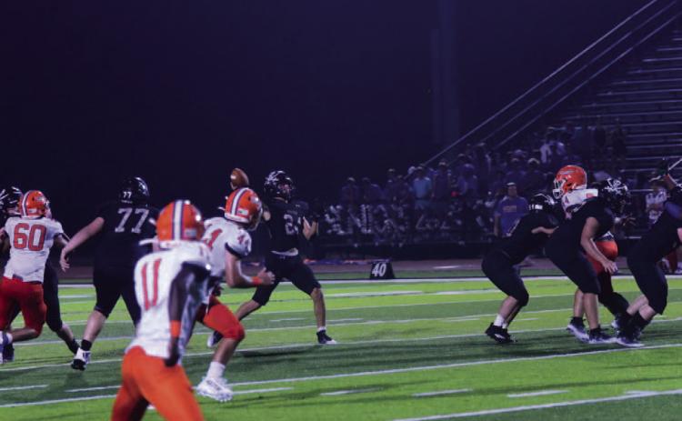 The Throw - Jarrett Odom lets fly a 30-yard TD pass to Daigen Venable who got behind the Saints’ defense and caught the ball in stride for a touchdown to put the Pirates up 45-14 with 2:19 left in the third quarter. Photos by Randall Luker