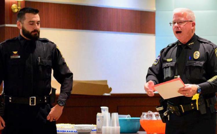 VPD officer Ethan Mansfield, left, was promoted to the rank of sergeant by VPD Chief Rod Carroll, left, in a cermony held at Vidor City Hall Monday. Courtesy Photos