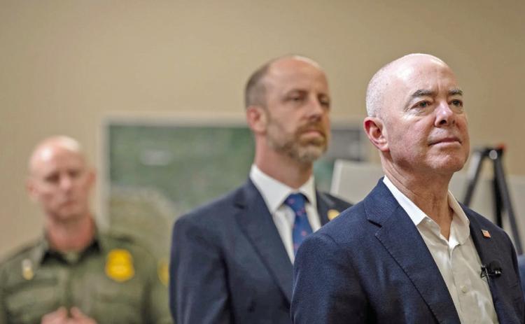 U.S. Secretary of Homeland Security Alejandro Mayorkas, right, listens as President Joe Biden receives a briefing from U.S. Customs and Border Protection, USCIS and ICE during a visit to Brownsville on Thursday, Feb. 29, 2024. Credit: Eli Hartman/ The Texas Tribune