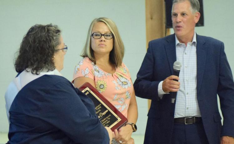 Captain Aleta Cappen is presented an appreciation plaque for her years of service to the city of Vidor by Mayor Misty Songe, center, and Vidor City Manager Robbie Hood, right, at her retirement celebration at The Oaks. Orange County and Texas Speaker of the House Date Phelan were also among those presenting Cappen with tokens of appreciation for her dedication and service to the community. Photo by Randall Luker