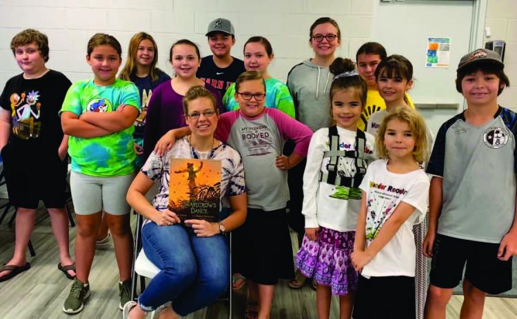 The Vidor Public Library held “Wonder Readers Story Time” on Thursday, October 6, 2022. Library clerk Sarah Screws read “The Scarecrow’s Dance” by Jane Yolen to the audience. The story is about a scarecrow who decides to leave his station in the corn field and dance away the fall night, returning to the field after his adventure. The children painted fall canvases for the craft. Courtesy Photo
