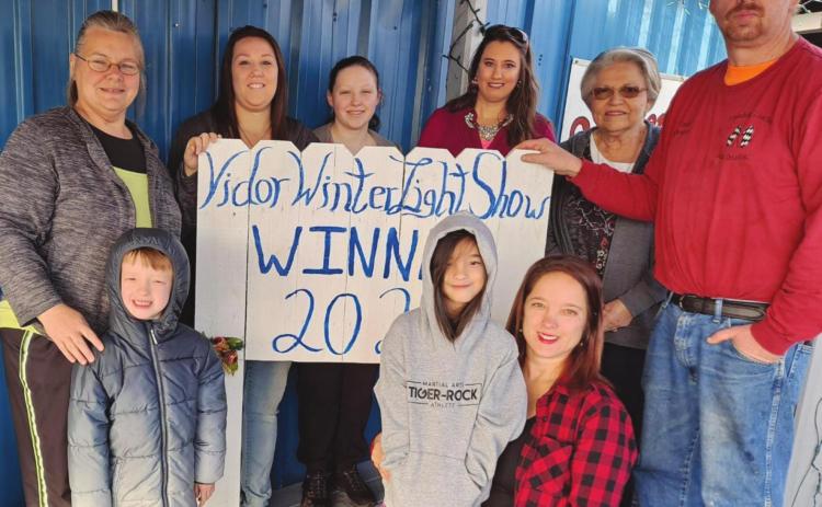 Finishing Touches Auto/Anderson Studio was selected as the winner of the 2020 Main Street Business Decorating Contest sponsored by the Vidor Winter Light Show. Pictured are Top row l to r Beverly Starkweather co-owner, Kristen Warren, Christine Grobel, Renee Lloyd, May Wilson, Paul Starkweather co-owner. Bottom row usual order Nathan Hawkins, Risa Hawkins, Kristy Hawkins, Risa Hawkins, Kristy Hawkins.