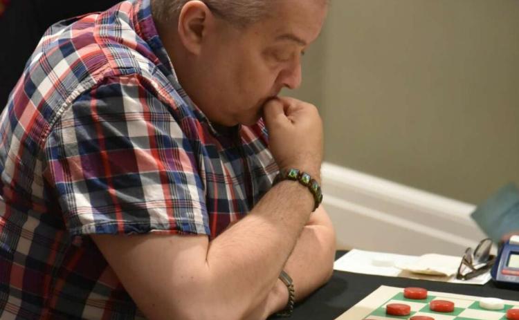 Nine-time world champion Alex Moiseyev contemplates his next move. Photo courtesy Watson Franks
