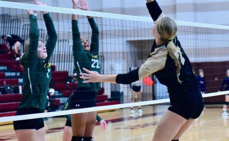 Junior varsity Lady Pirate Jaelyn Justice returns the ball in Saturday’s game versus LCM.