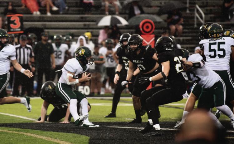 Vidor’s defensive line bars the way for an Indian ball carrier in Friday’s home opener versus the Santa Fe Indians.
