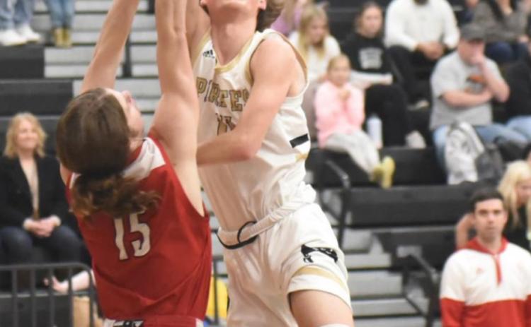 Zander Lindsey shoots during Tuesday’s game versus Bridge City. Photo by Randall Luker