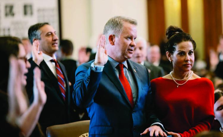 State Rep. David Cook, R-Mansfield, takes the oath of office with his hand on a bible on the first day of the 88th legislature on Jan 10, 2023. Credit: Jordan Vonderhaar for The Texas Tribune