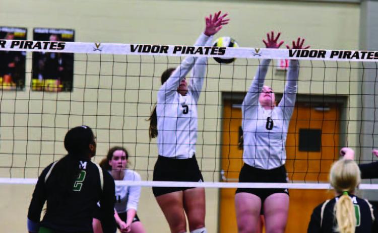 Lady Pirates Rylee Sherman, rear left, Madison Powell and Natalie Morrison defend agains the LCM Lady Bears. Photo by Randall Luker