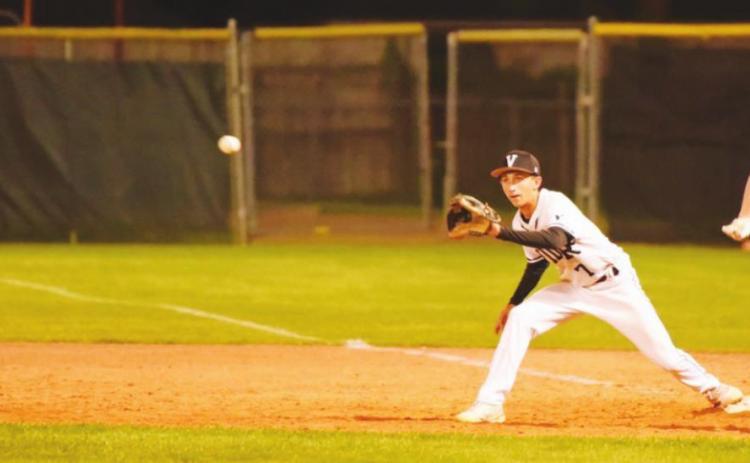 Pirate first baseman Easton Walker keeps his foot on the bag as he awaits the throw for a Bobcat out.