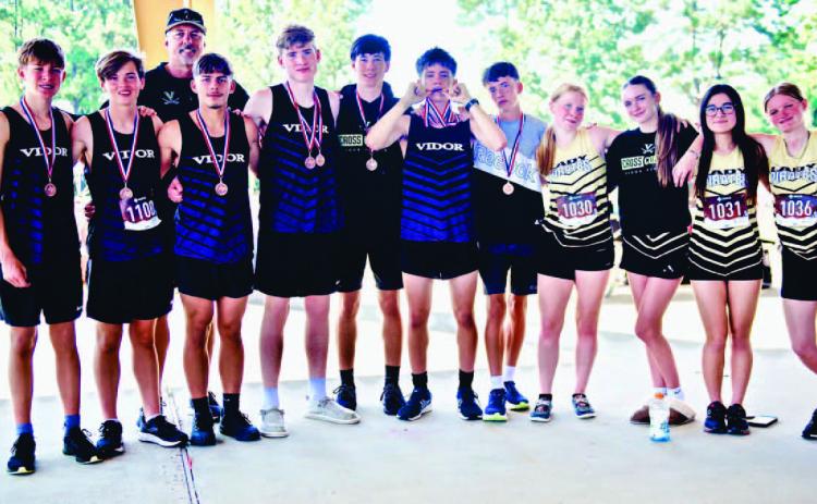VHS Cross Country Team (Left to Right) Braedyn Leger, Nathan Fawcett, Coach Smith, Jose Guerrero - Evans, Michael Huish, George Williamson, Zane Williamson, Coy Lightfoot, (Girls) Kynnison Cook, Averie Garris, Isabella Findley, Lexi White. (not pictured) Lily Hyde.