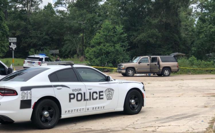 Investigators tape off the area where the body of a Bon Wier man was found Wednesday off FM 1132 near the State Highway 12 intersection. Courtesy Photo