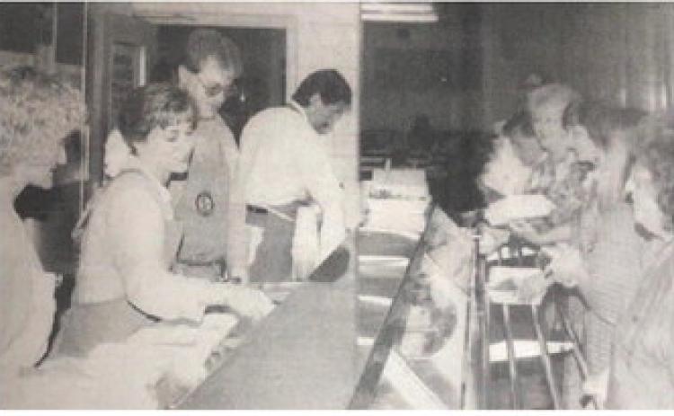 Vidor Rotarians, left to right, Karla Rogers, Suzanne Harris, Curtis Collum, Randy Wright, dish up the fish and chicken for hungry supporters at their annual fund raising dinner Monday night at the Vidor Junior High School cafeteria. There was a repeat performance Tuesday evening.