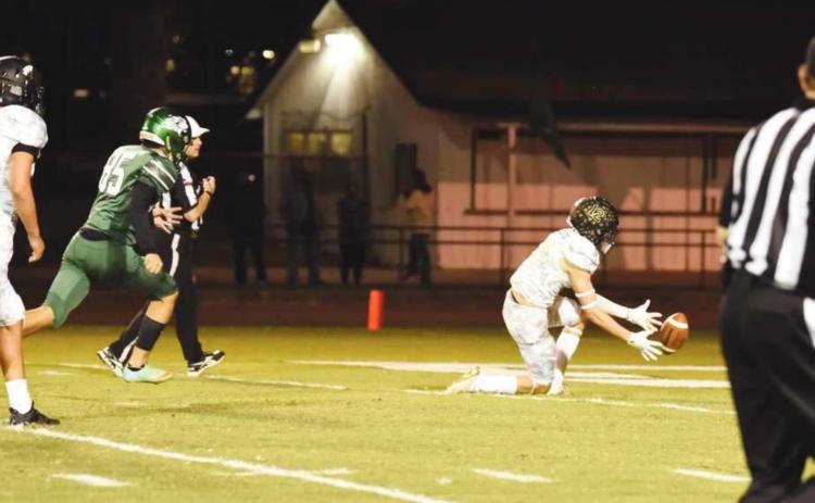 Dayton Whitmire scored a defensive touchdown for the Pirates when he covered the ball in the Lions’ end zone after a blocked punt in the waning seconds of the game Friday.