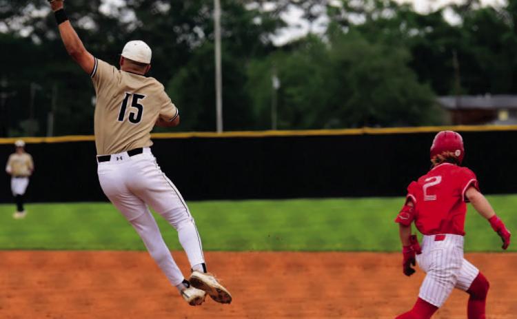 Pirate first baseman Jarrett Odom jumps to pull in an overthrown ball in Monday’s loss to Bridge City. Photo by Randall Luker