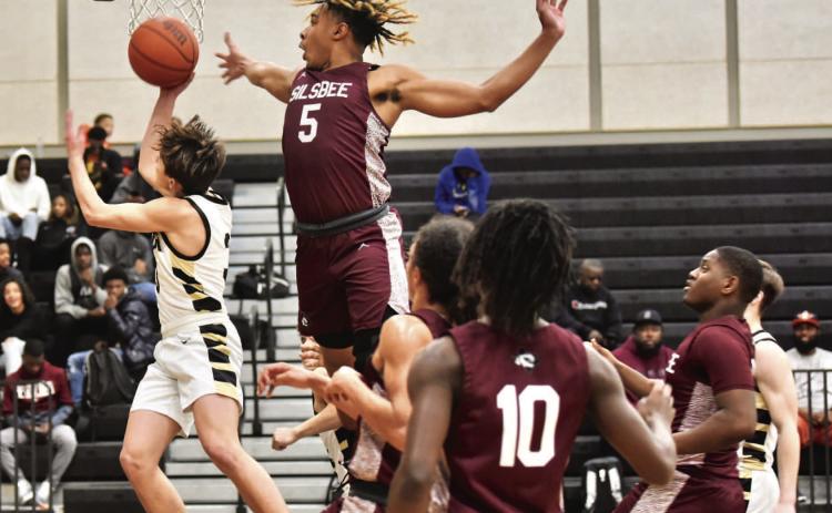 Jose Guerrero-Evans attempts a layup in Friday’s varsity game versus Silsbee. Photo by Randall Luker