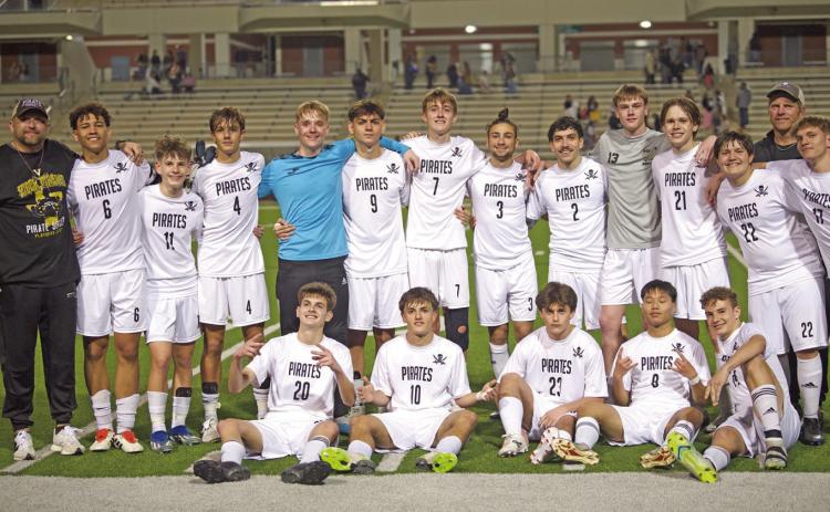 Pirates celebrate their bi-district win Monday.