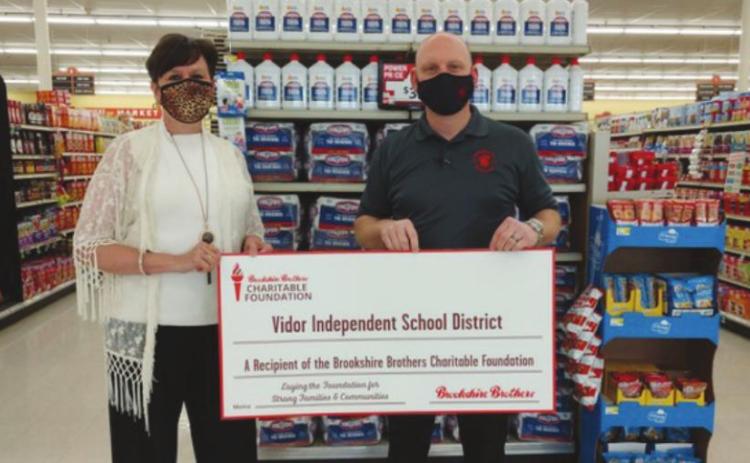 The Brookshire Brothers Charitable Foundation proudly presented a grant to the Vidor Independent School District on Wednesday, February 24, 2021. Pictured from left to right: Sally Andrews, VISD; and Robert Williamson, Brookshire Brothers store director.