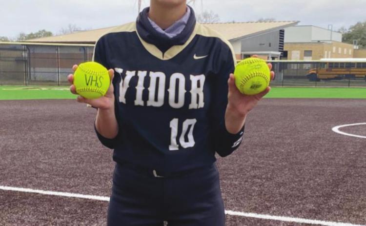 Andreya Garrett holds her two home run balls from the Hardin game.
