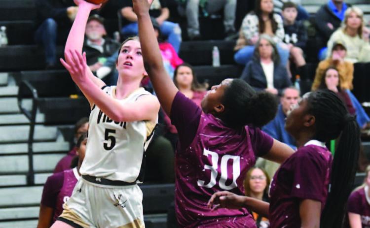 Hadley Jackson shoots from the outside in Friday’s home game versus Silsbee.