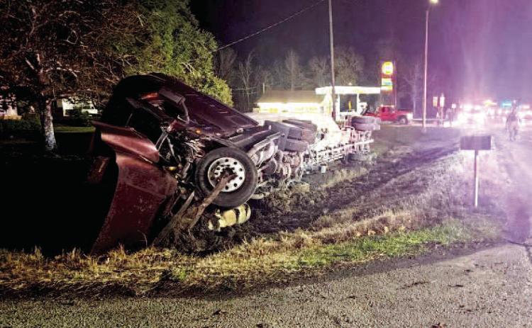 Overturned 18 wheeler shuts down FM 105 temporarily